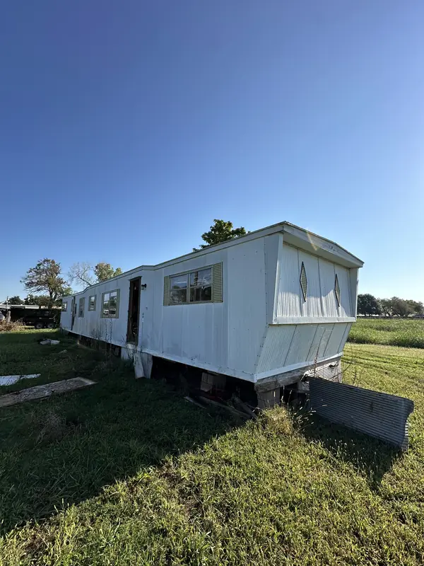 Old mobile home before removal — BPS on site
