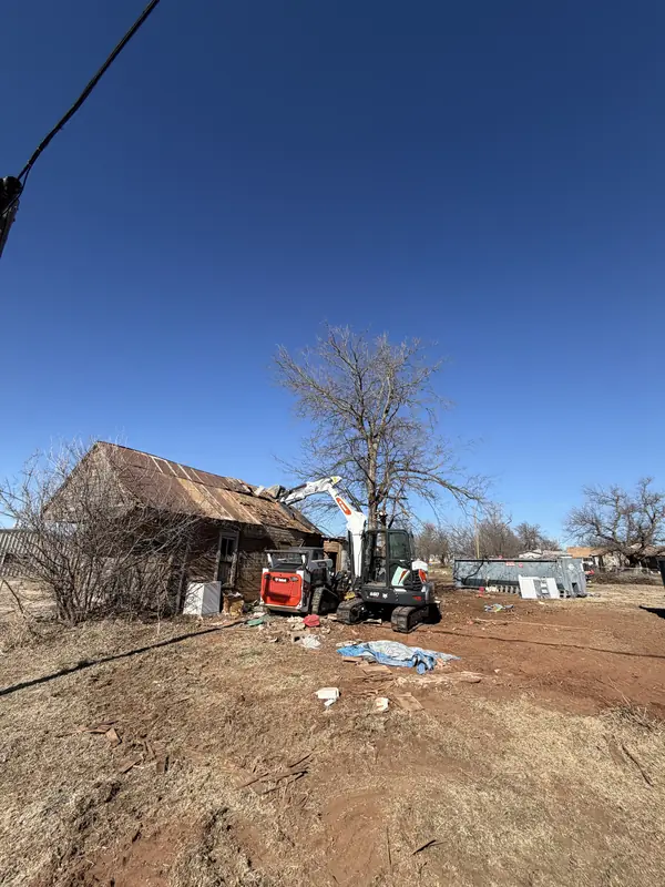 Bobcat E60 tearing down old wooden barn