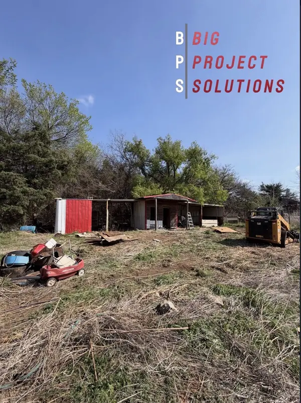 Bobcat E60 mid-teardown on residential house