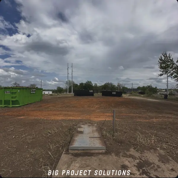 Graded red dirt lot — structure fully removed