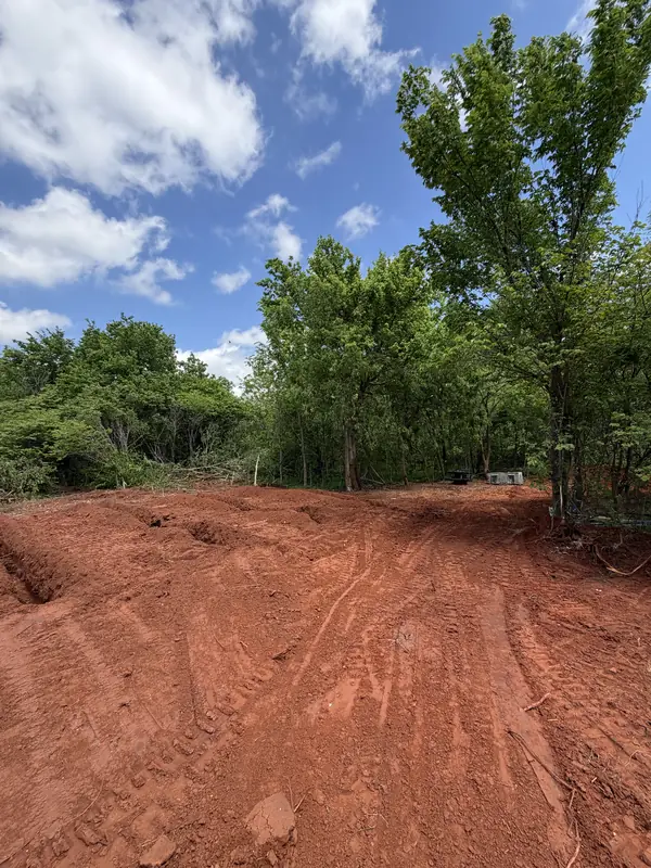 Graded red dirt road — land development prep