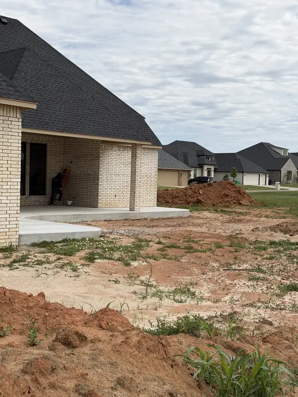 New construction site — circular drive and site grading