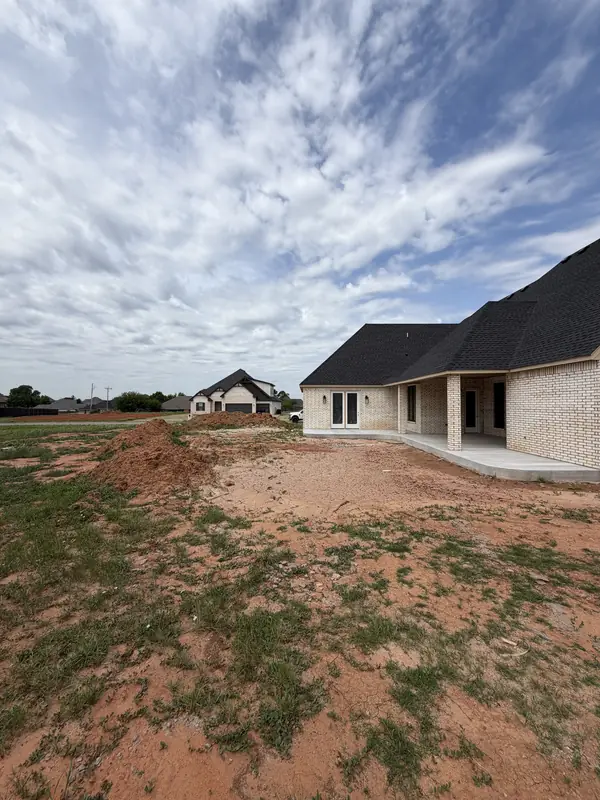 Brick home — circular concrete drive freshly poured