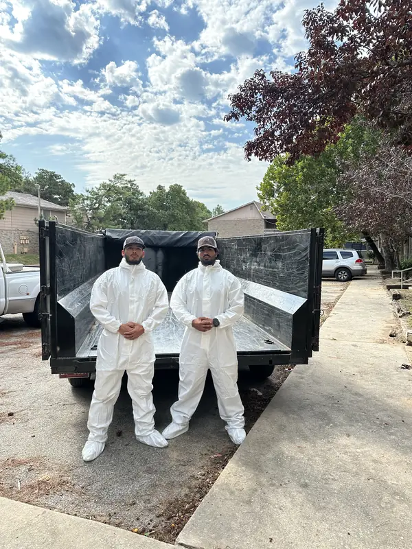 Crew on site with a dumpster trailer ready for loading